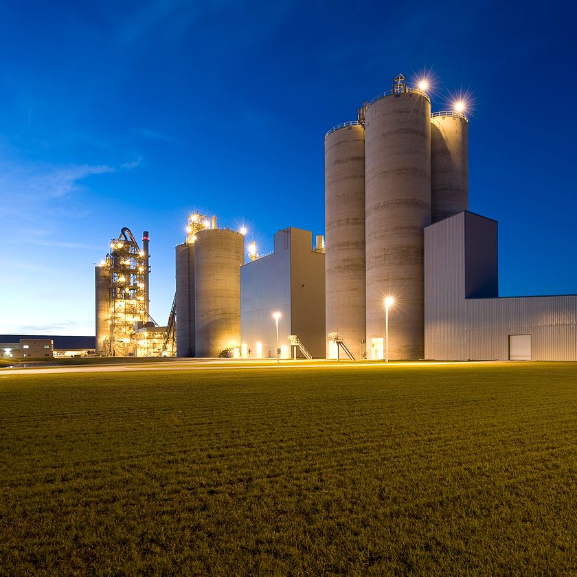 CRH cement production facility illuminated at night