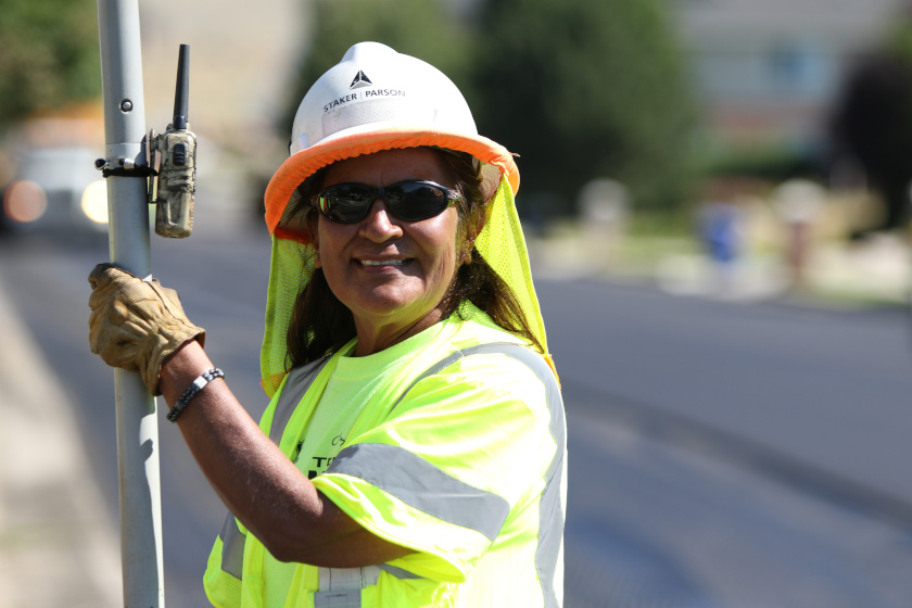 female worker with walkie talkie