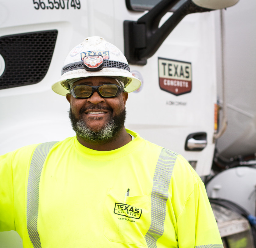 male Texas Concrete worker standing near truck