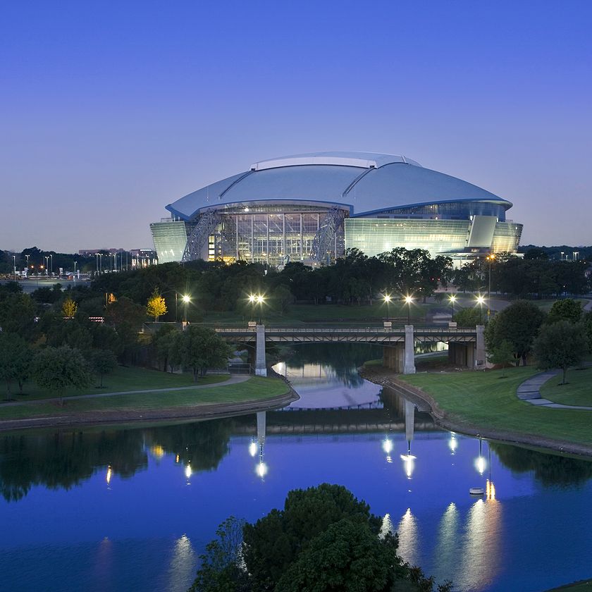 Dallas Cowboys AT&T stadium built with CRH materials illuminated at night