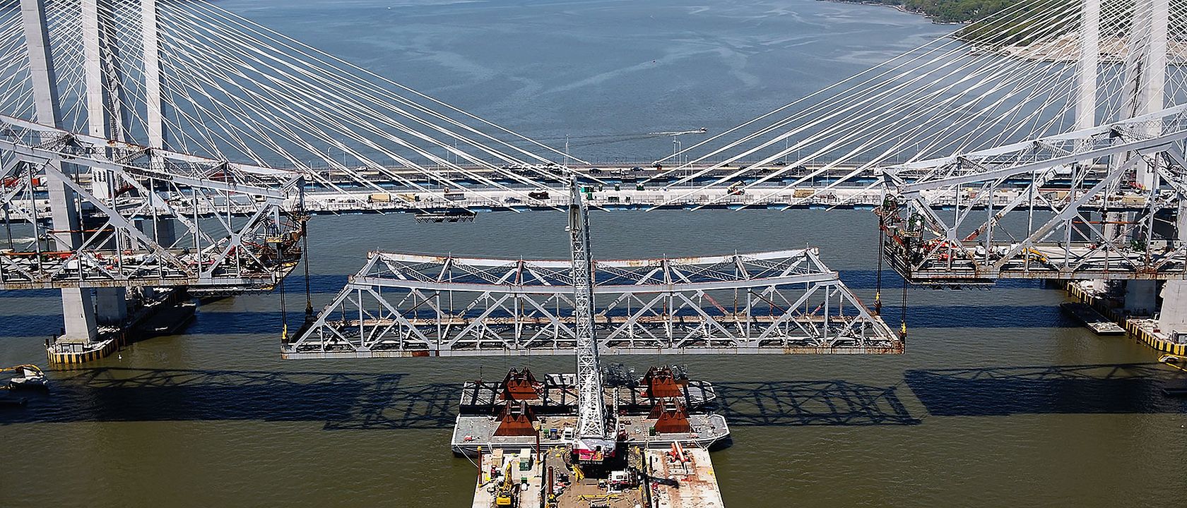 CRH raising a section of a bridge in New York during construction